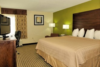 Comfortable King Size bed perfect for couples traveling to Jacksonville NC